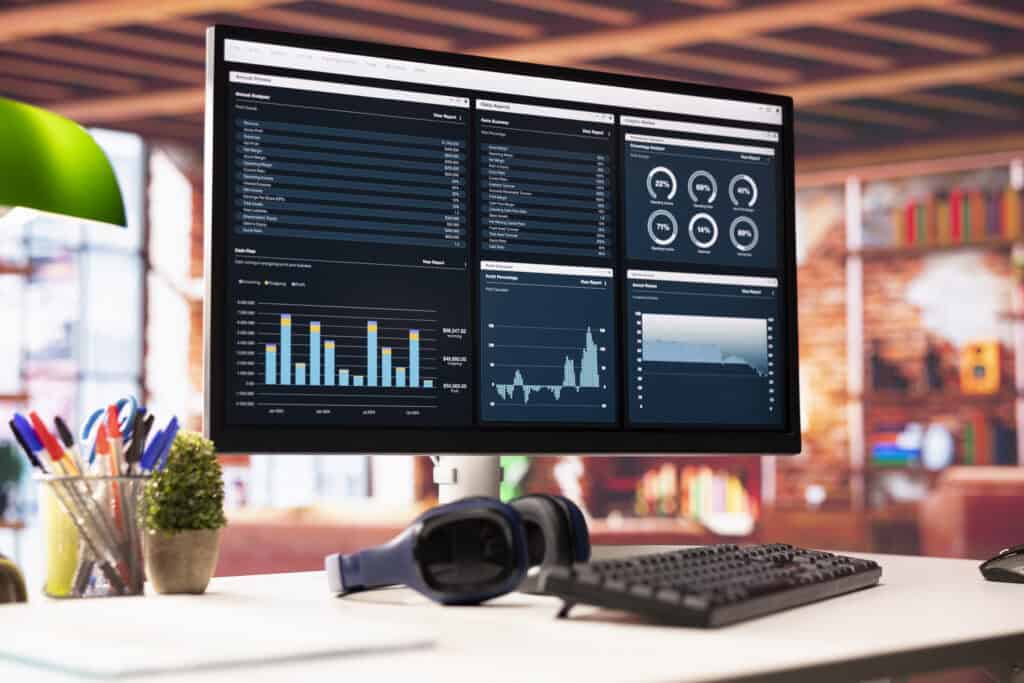 Business data analytics dashboard with charts and metrics on a computer screen.